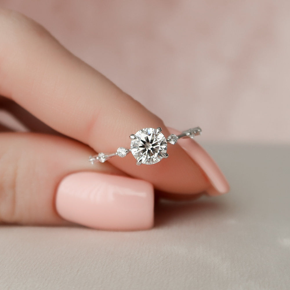 
                  
                    1.0 CT Round Solitaire & Dainty Pave Moissanite Engagement Ring 1
                  
                